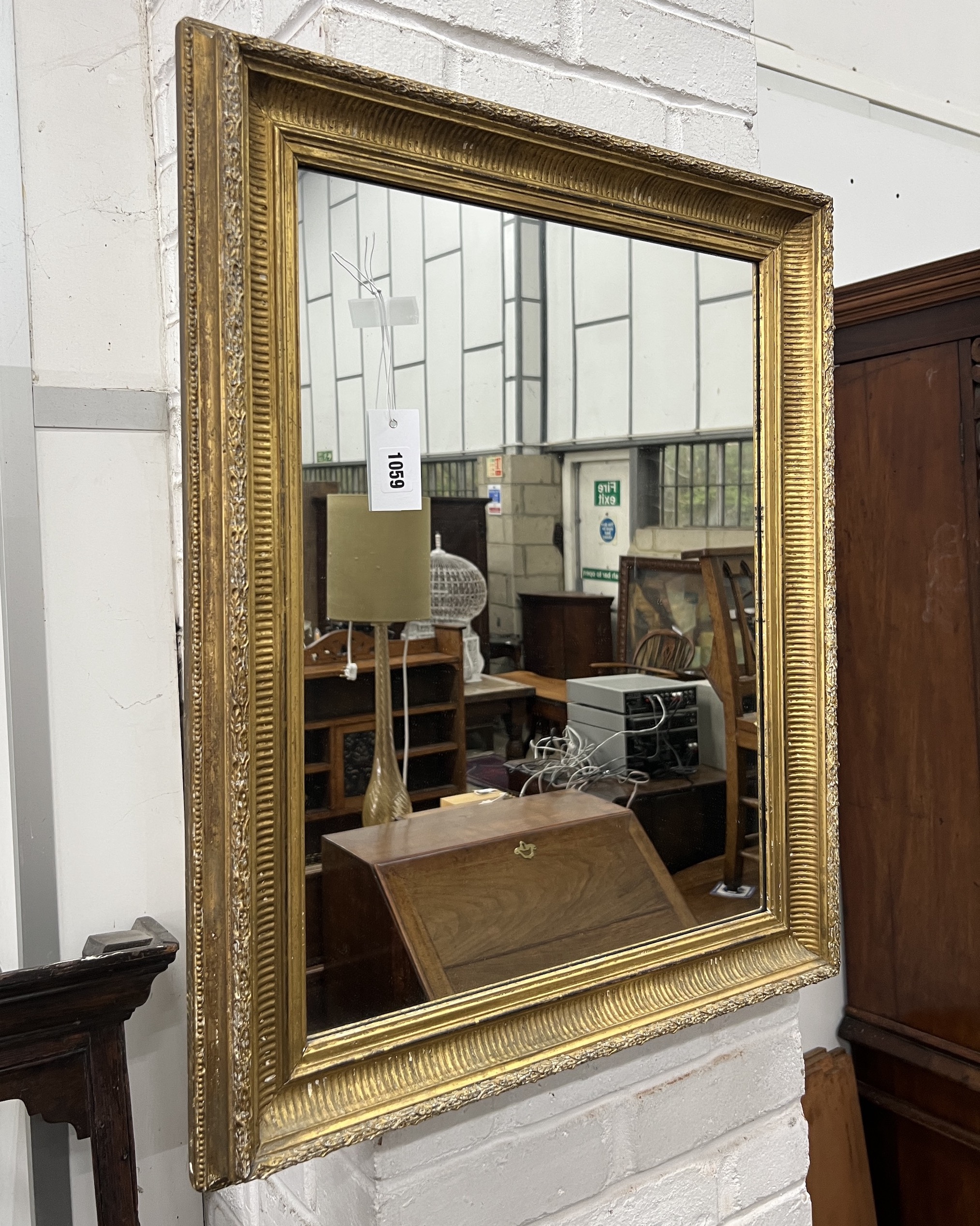 A rectangular giltwood and composition wall mirror, width 59cm, height 74cm together with an Indonesian rectangular hardwood wall mirror
